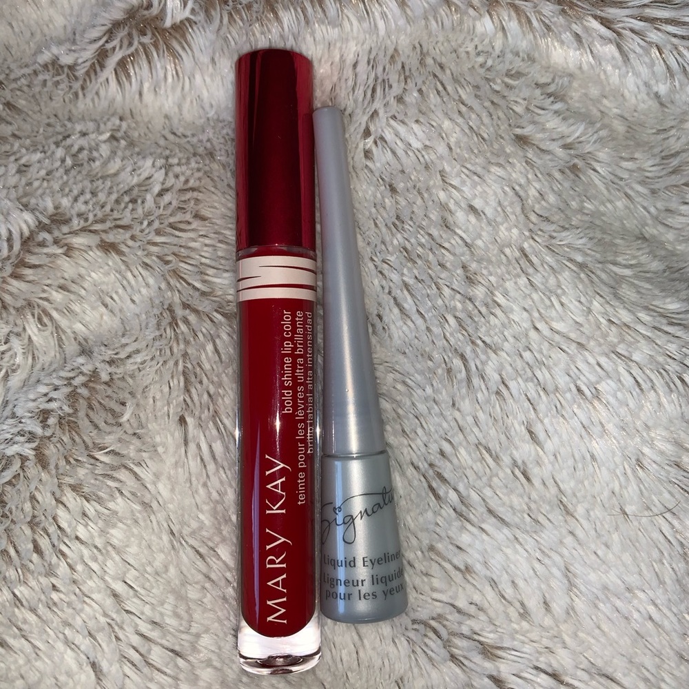Mary may lip gloss and eyeliner.